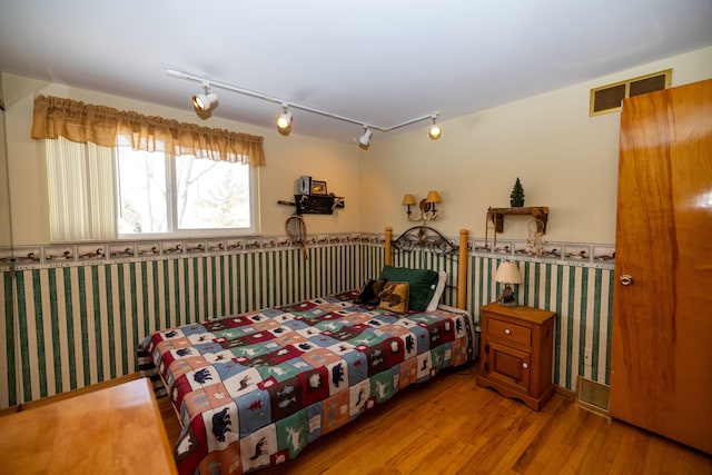 bedroom featuring light wood-type flooring