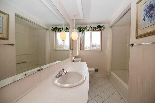 bathroom featuring vanity, tile patterned floors, and toilet