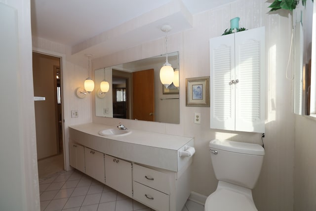 bathroom with vanity, toilet, and tile patterned flooring