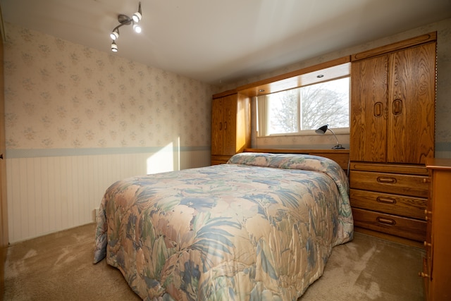 bedroom with light colored carpet