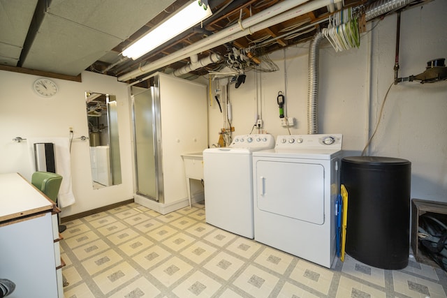 clothes washing area featuring independent washer and dryer