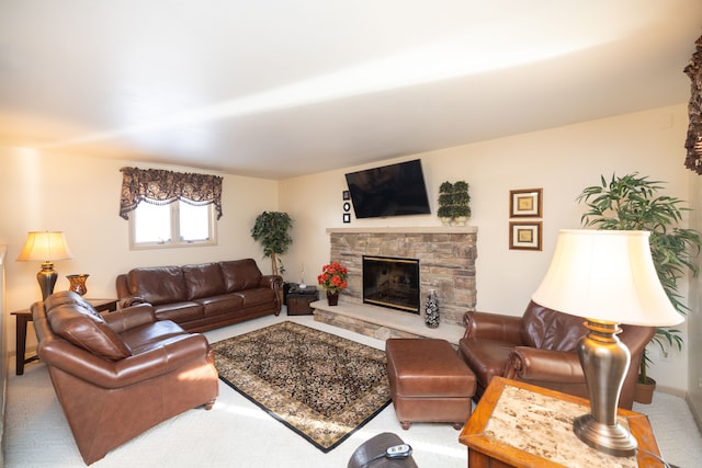 living room with a stone fireplace