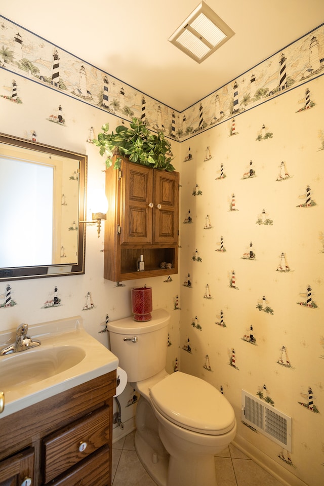 bathroom featuring vanity, toilet, and tile patterned flooring