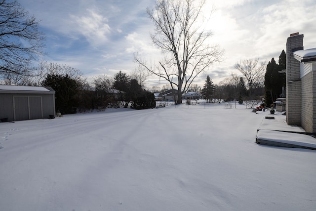 view of yard layered in snow