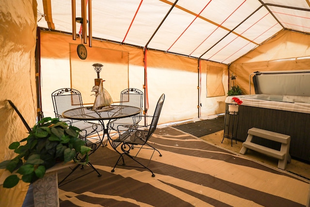 view of patio with a hot tub