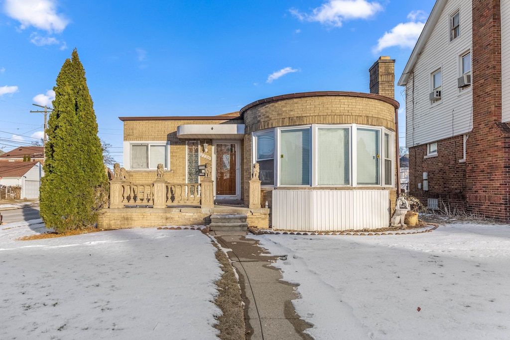 view of front of home featuring cooling unit