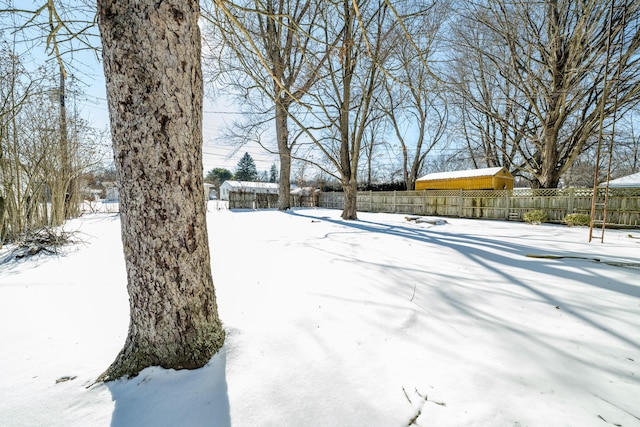 view of yard layered in snow