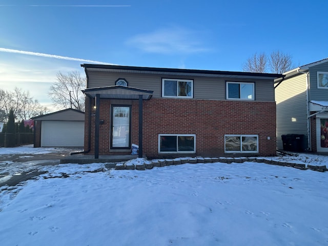 view of front of home with a garage and an outdoor structure