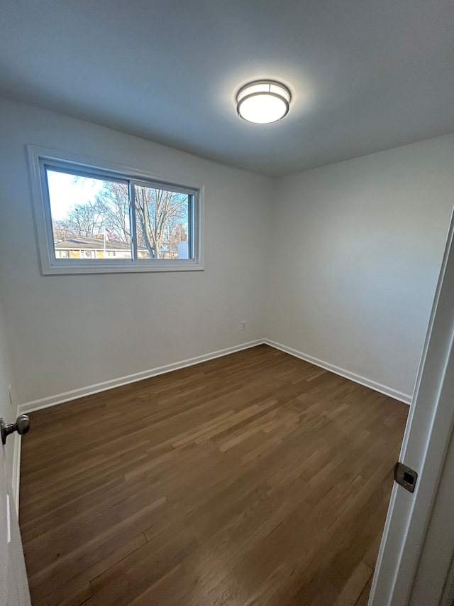 unfurnished room featuring dark hardwood / wood-style floors