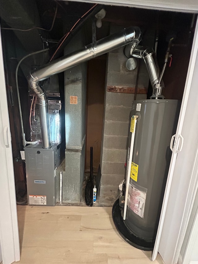 utility room featuring gas water heater