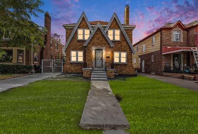 tudor-style house with a lawn