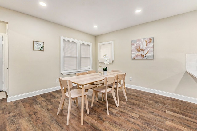 dining room with dark hardwood / wood-style floors