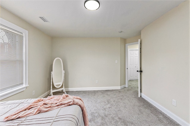 unfurnished bedroom with light carpet