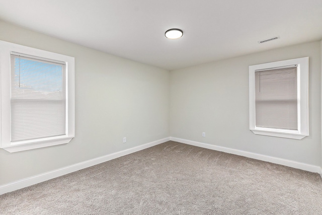 unfurnished room featuring carpet flooring