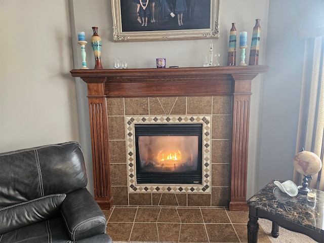 sitting room featuring a tile fireplace