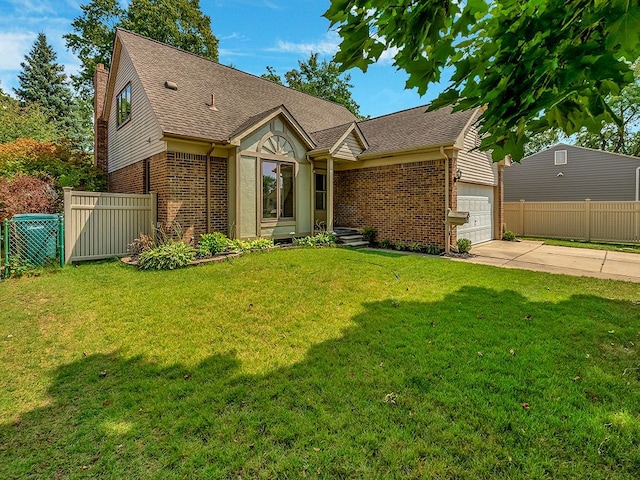 view of front of home with a garage and a front lawn