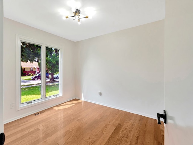 unfurnished room featuring light hardwood / wood-style flooring and a wealth of natural light