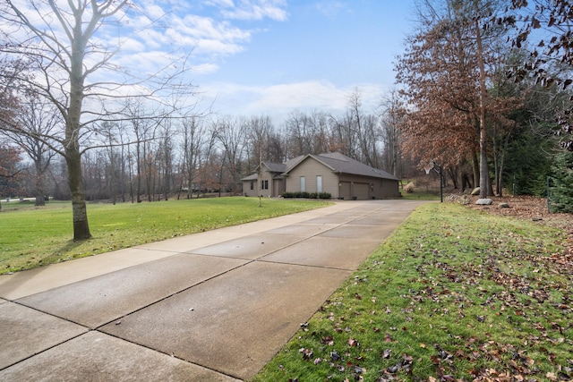 exterior space featuring a garage and a front lawn