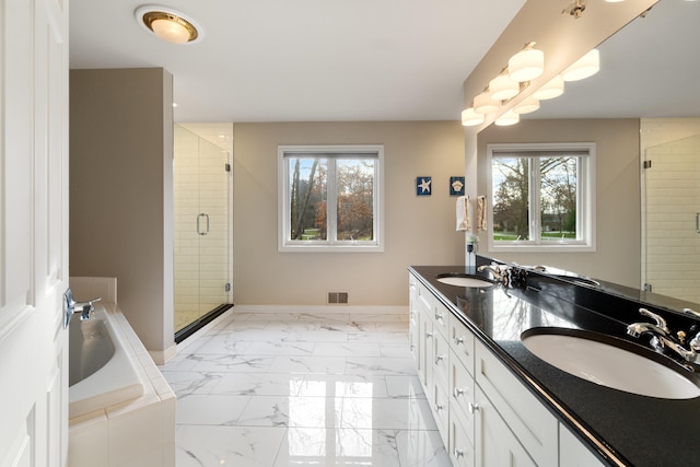 bathroom with vanity and plus walk in shower