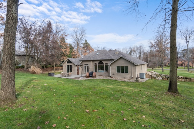 back of house with a yard, central AC, and a patio