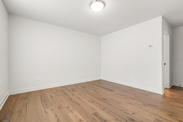 empty room with light wood-type flooring