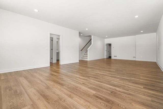 unfurnished living room with light wood-type flooring