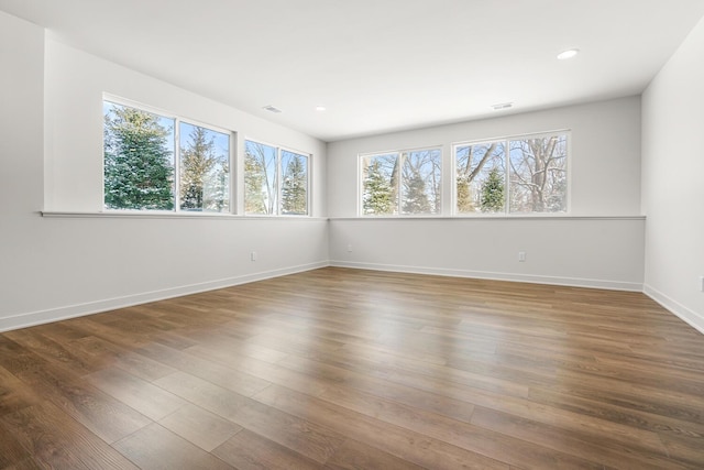 spare room featuring hardwood / wood-style flooring