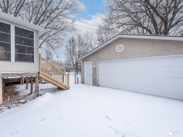 view of snow covered garage