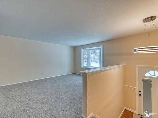 interior space featuring a textured ceiling