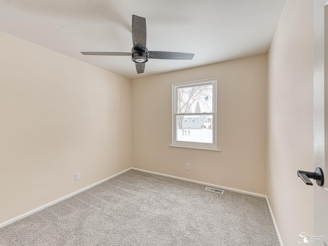 empty room with carpet flooring and ceiling fan