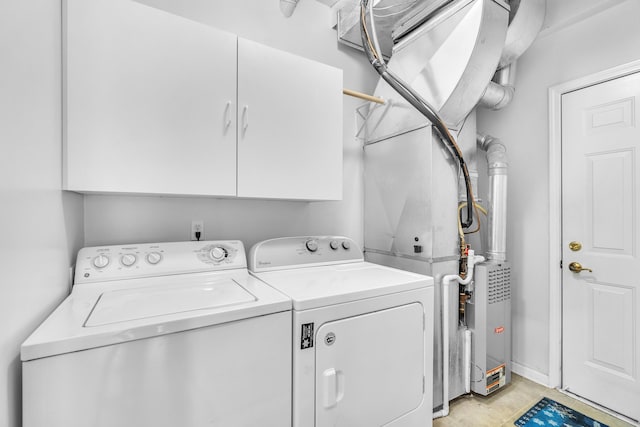 laundry area featuring cabinets and independent washer and dryer