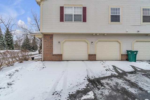 view of snow covered garage