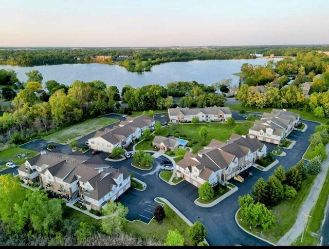 aerial view at dusk with a water view