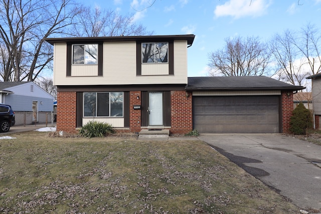 view of front of house featuring a garage and a front yard