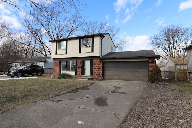 view of front of home with a garage and a front lawn