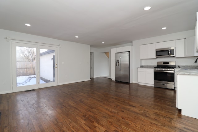 kitchen featuring sink, stainless steel appliances, dark hardwood / wood-style floors, and white cabinets