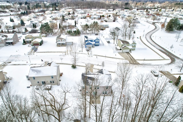 snowy aerial view featuring a residential view