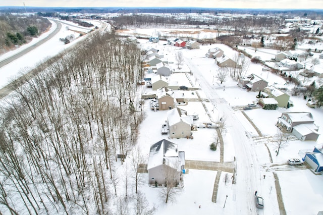 snowy aerial view with a residential view