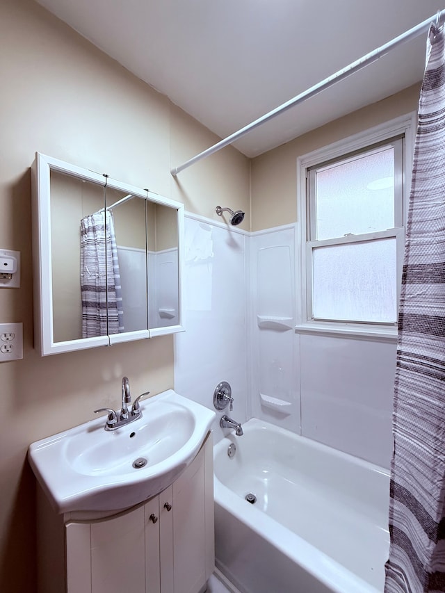 bathroom with vanity and shower / bath combo