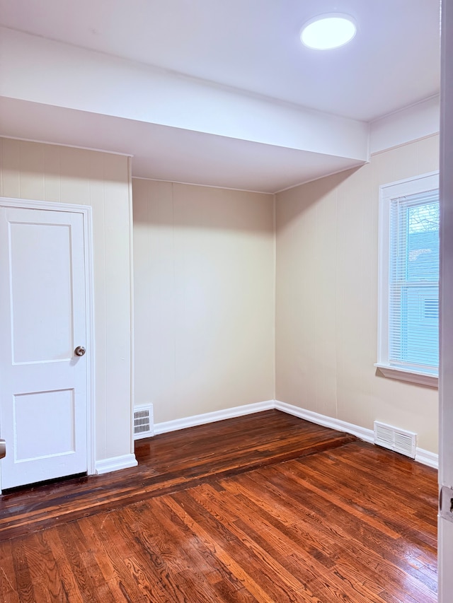 basement with dark wood-type flooring