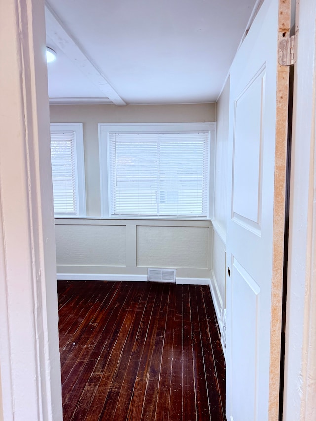 unfurnished room with dark hardwood / wood-style flooring