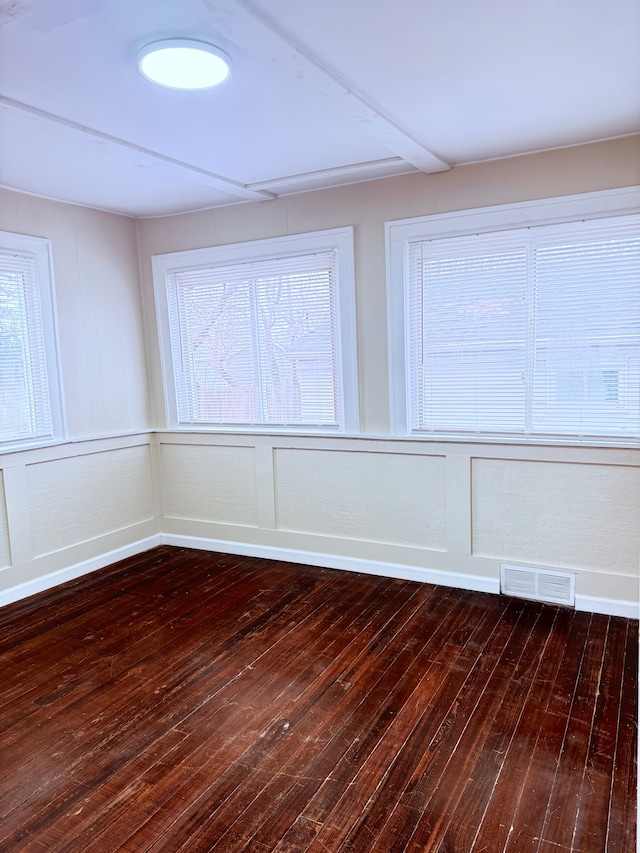 empty room with dark wood-type flooring