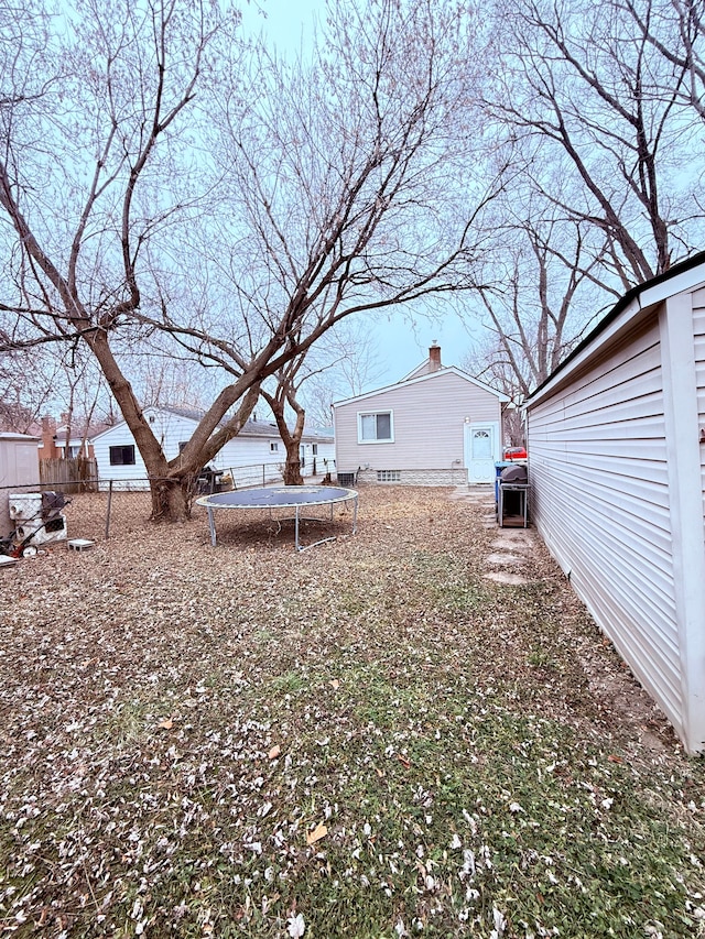 view of yard featuring a trampoline