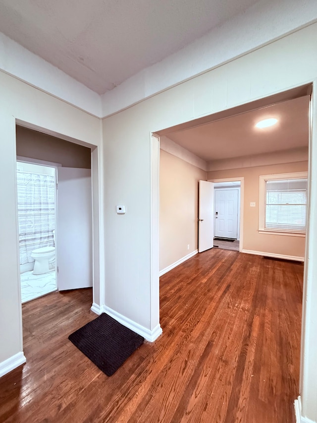 spare room with dark hardwood / wood-style floors