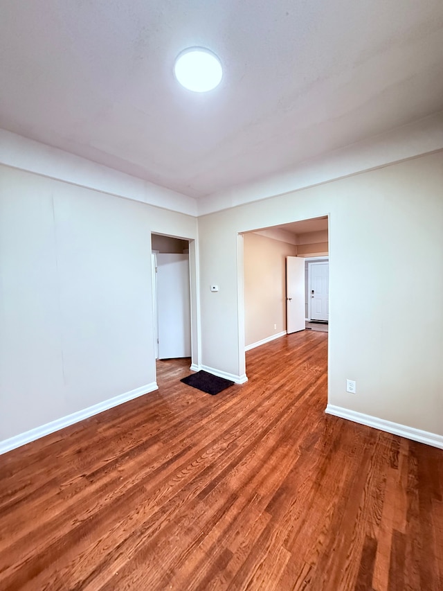 spare room with hardwood / wood-style floors