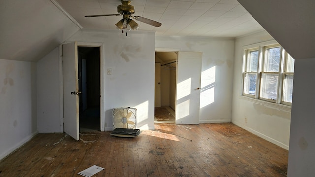 bonus room featuring vaulted ceiling, dark wood-type flooring, and ceiling fan