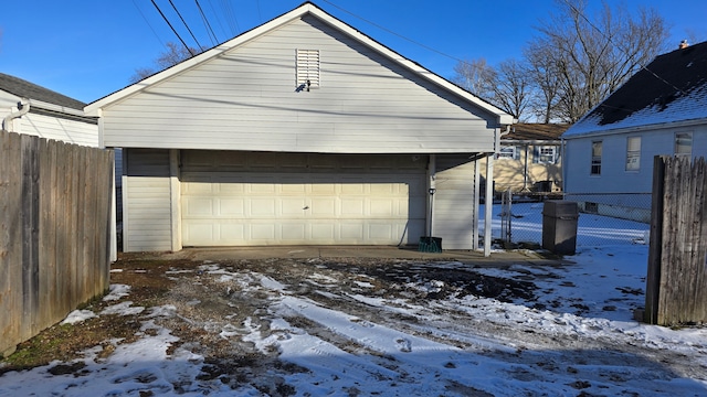 view of snow covered garage