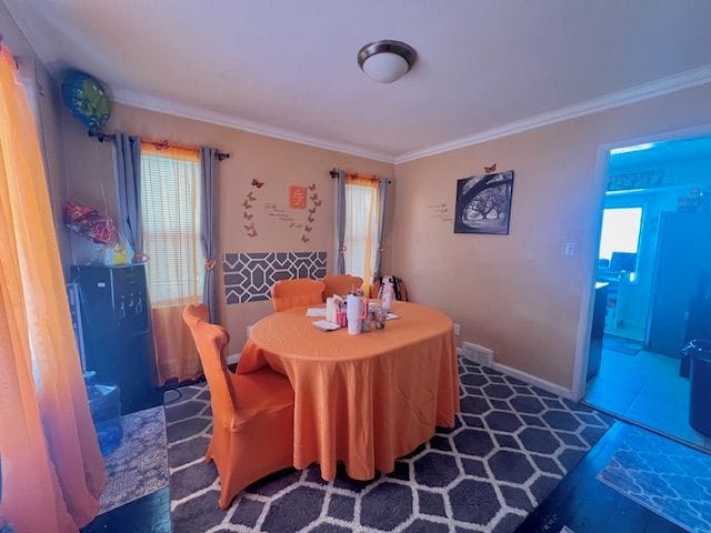 dining room with crown molding