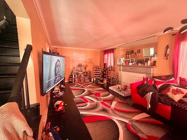 living room with crown molding