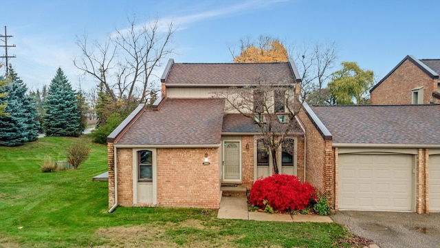 view of front of house with a garage and a front yard